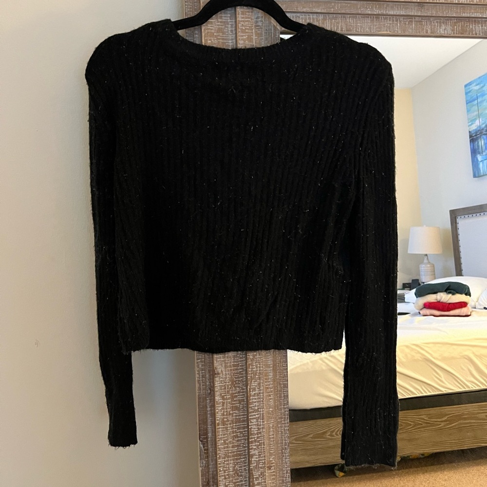 Black sweater. Size M. 47% acrylic, 30% nylon, 20% rayon, 3% spandex.